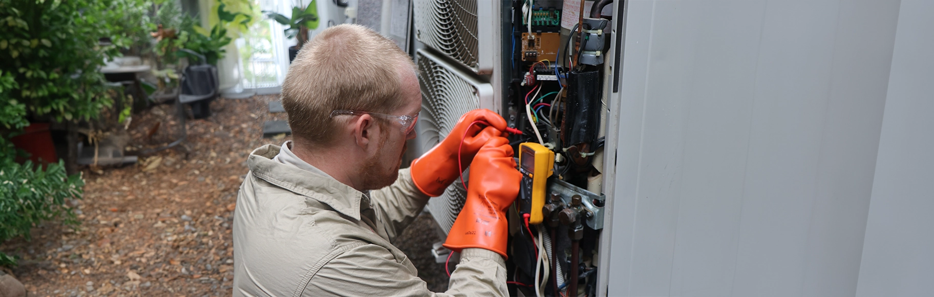 Fallon Solutions master electrician testing an external switchboard.